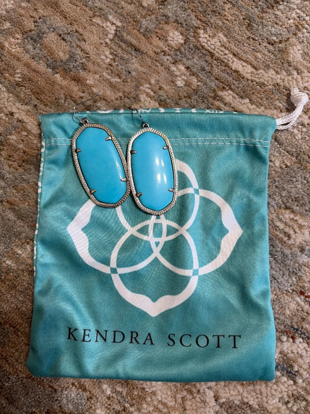 Kendra Scott earrings.